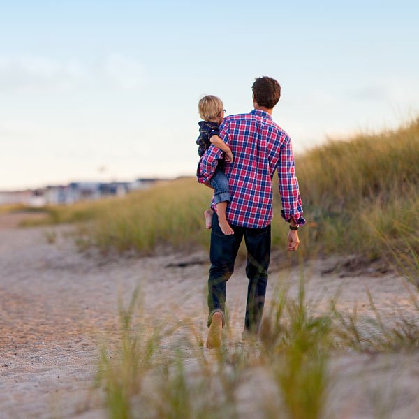 Father and Child Walking on the Beach